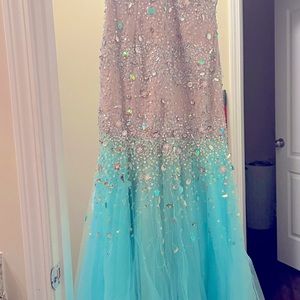 Hand stitched stones on this this beautiful prom dress, Worn twice.